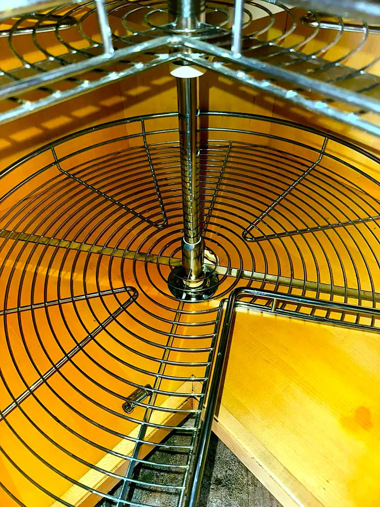 The same carousel unit cleaned back to bare, spotless wood